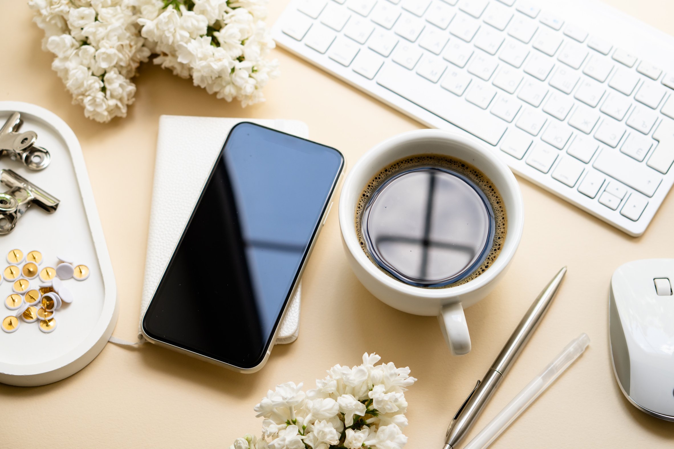 Keyboard and Mouse with Coffee and Smartphone on Neutral Background